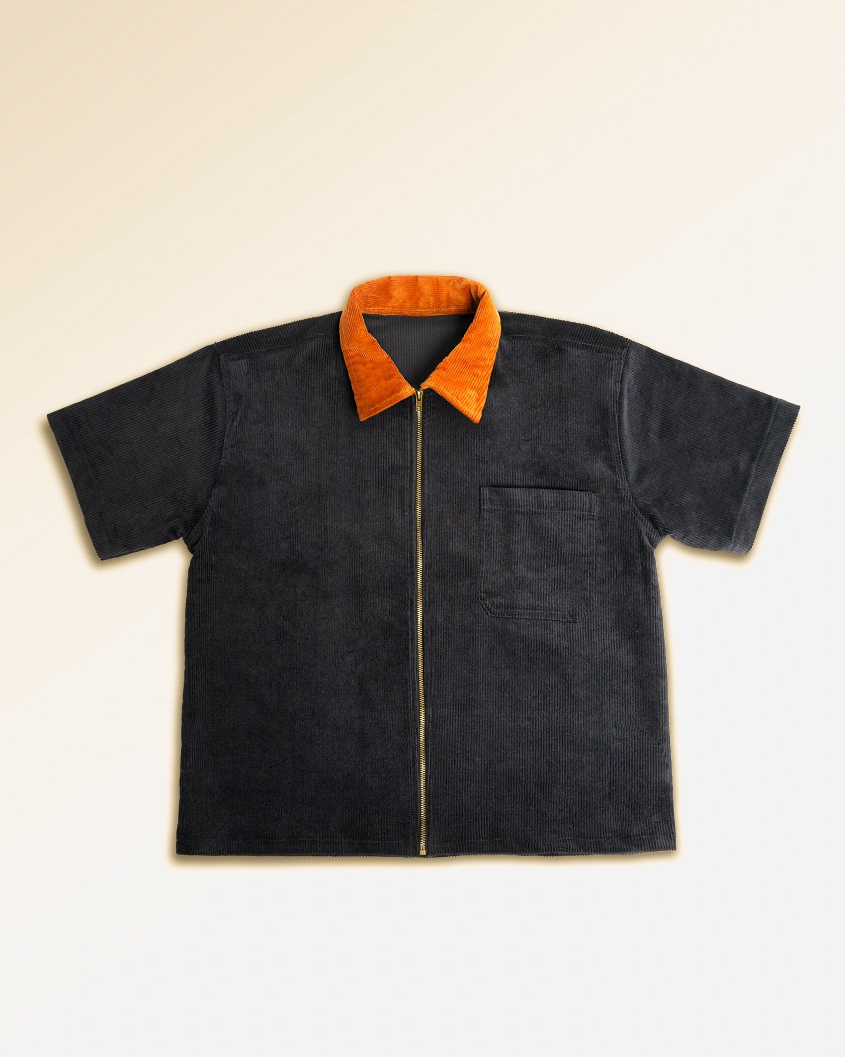 Navy workshirt laid flat, rust corduroy collar and full brass zip